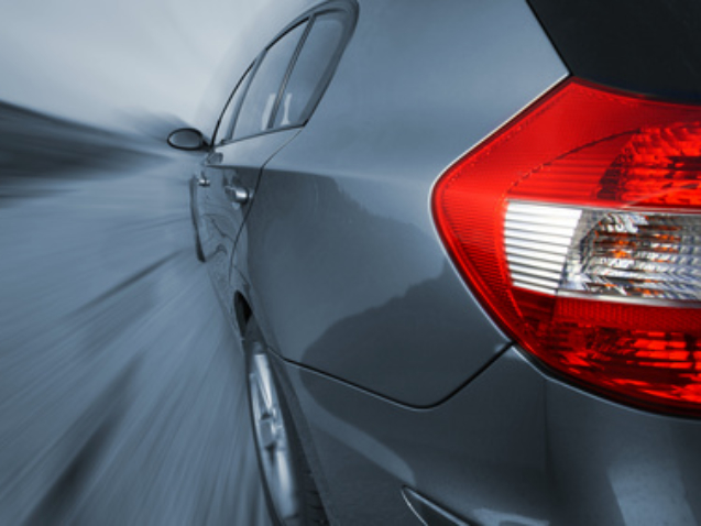Front view of a sports car, shot with a wide angle lense. No logo shown.